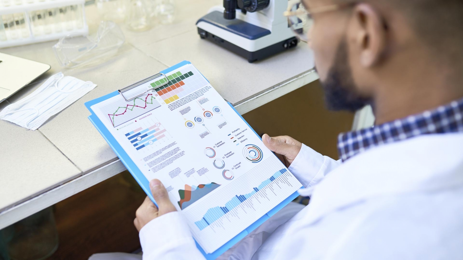 Scientist looking at a medical data report