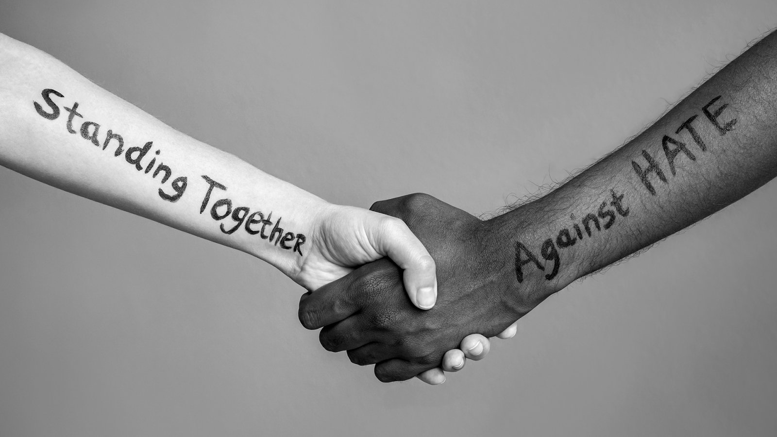 Two hands - Standing together against hate