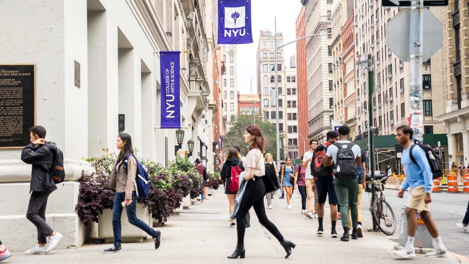 Students walking around NYU campus