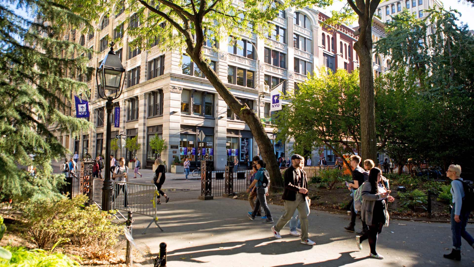 NYU Students walking through Washington Square Park