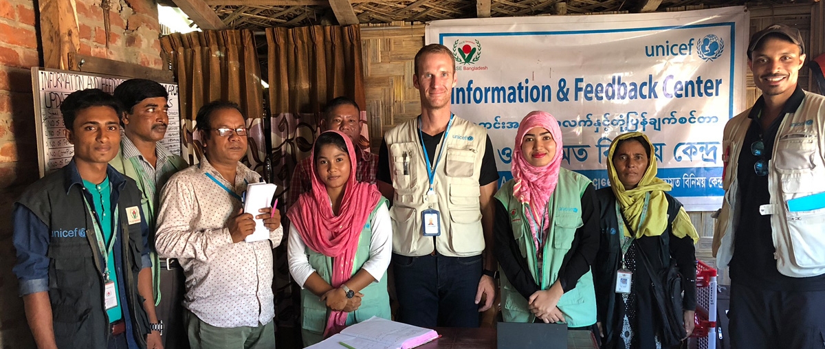 Students posing with local health officials in group photo