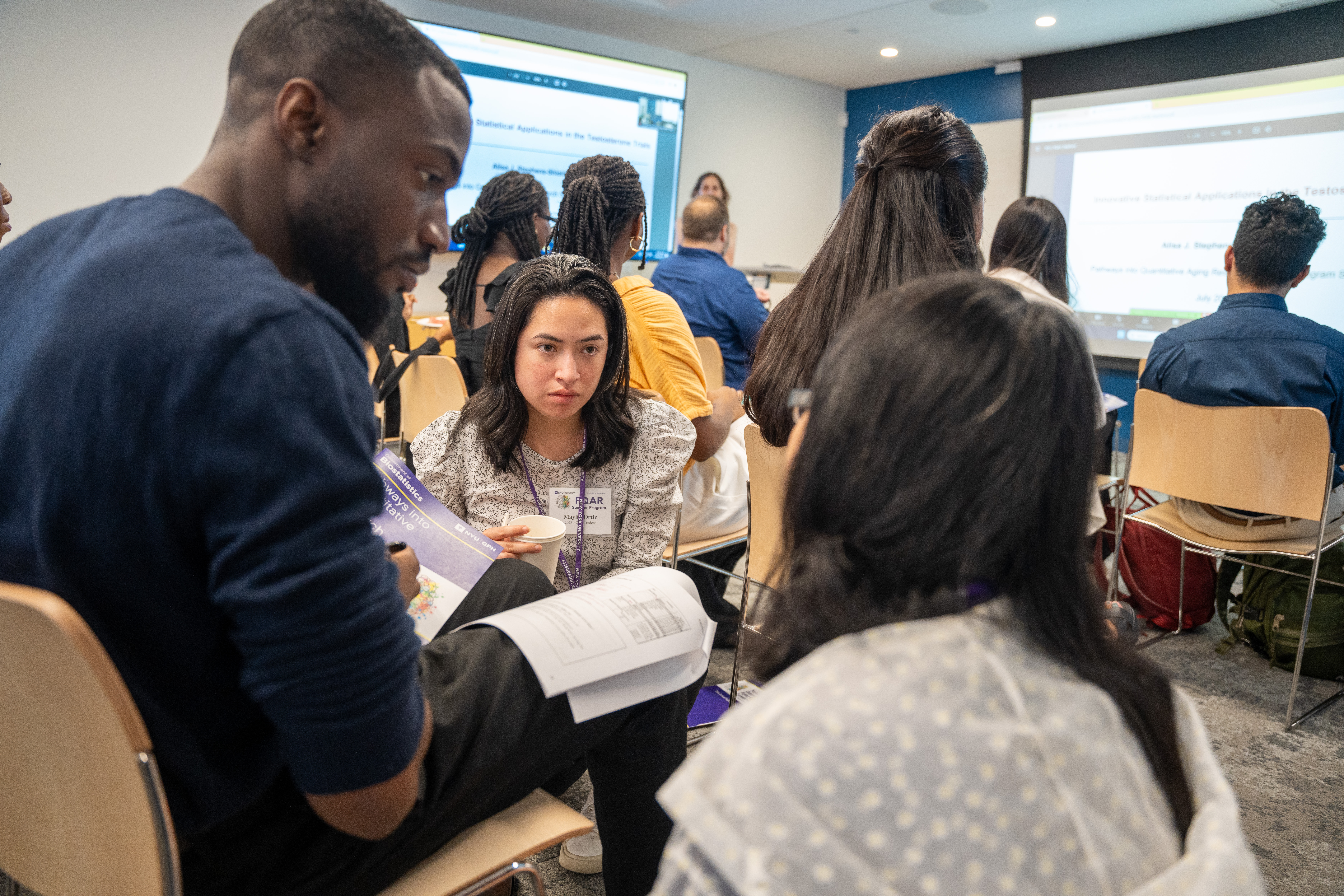 PQAR students discussing at the symposium