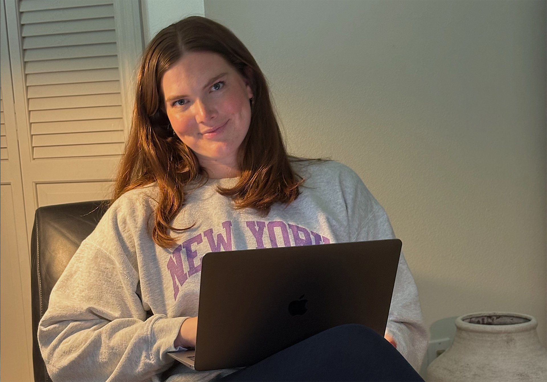 Chloe working on her laptop