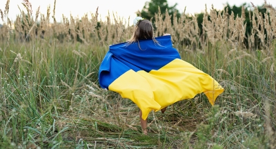 Ukrainian child with Ukrainian flag