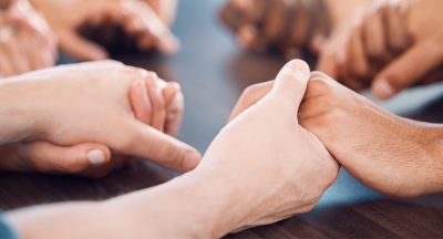 Circle of people holding hands