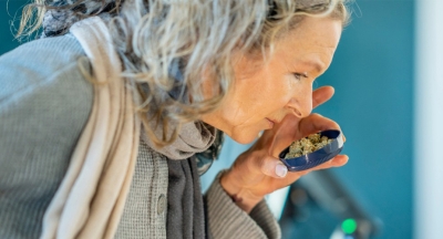 Woman smelling cannabis