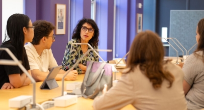 Students meeting with a professor.