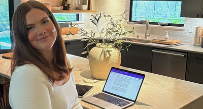 Chloe working from her kitchen counter