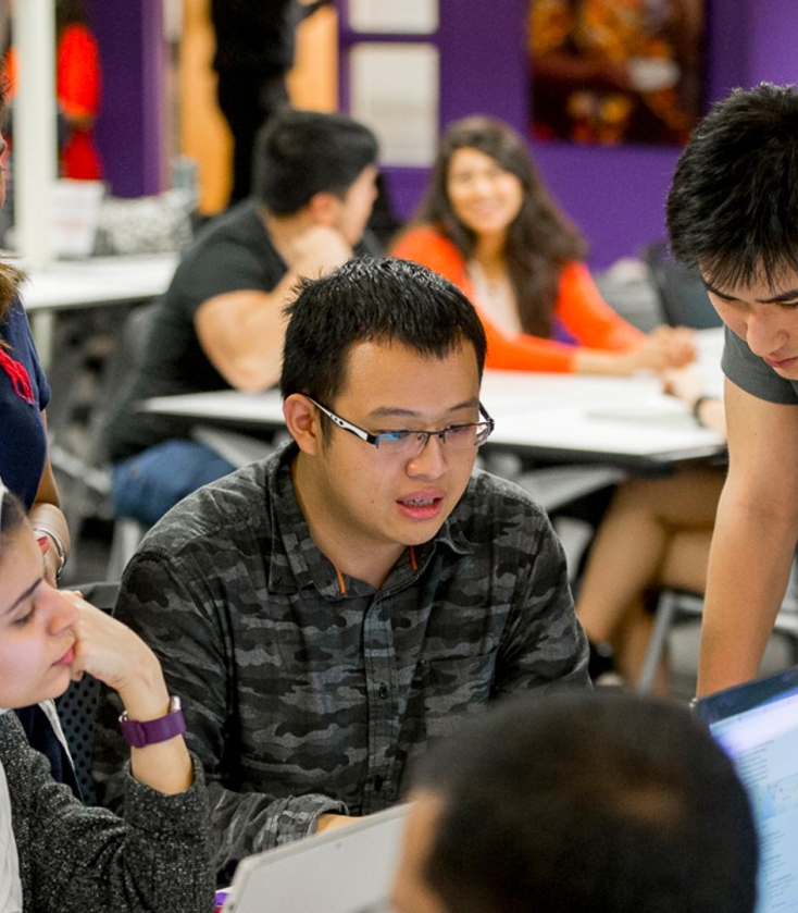 Students working around a table