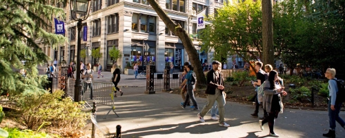 Students walking through Washington Square Park