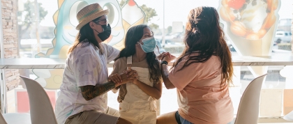 Latino family wearing masks