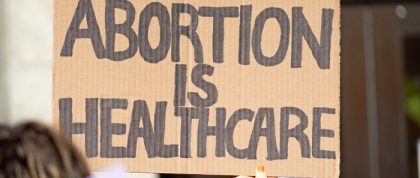 Cardboard sign saying Abortion is Healthcare