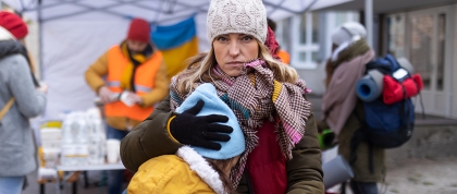 Migrant mother holding her child