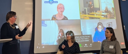 Presenters pointing at a projection screen with zoom panelists